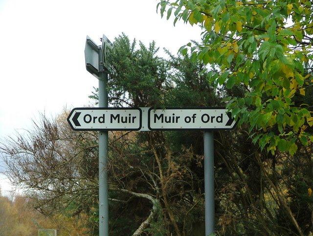 Sign left says 'Ord Muir', sign right says 'Muir of Ord'